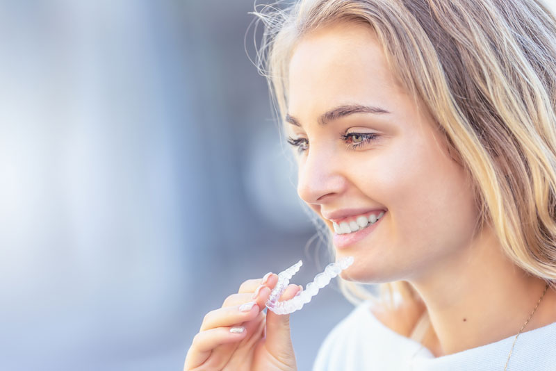 a dental implant patient with clear aligners.