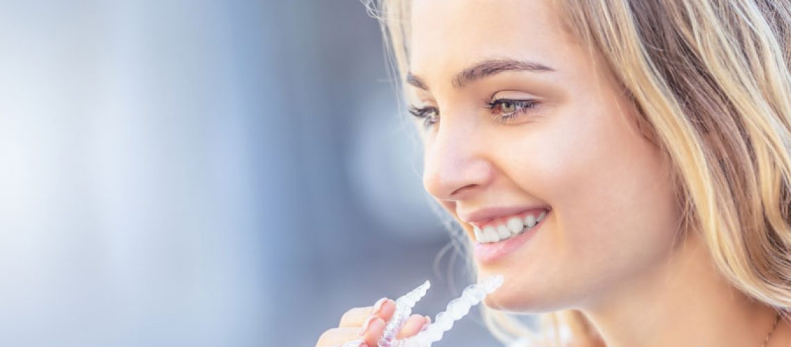 a dental implant patient with clear aligners.